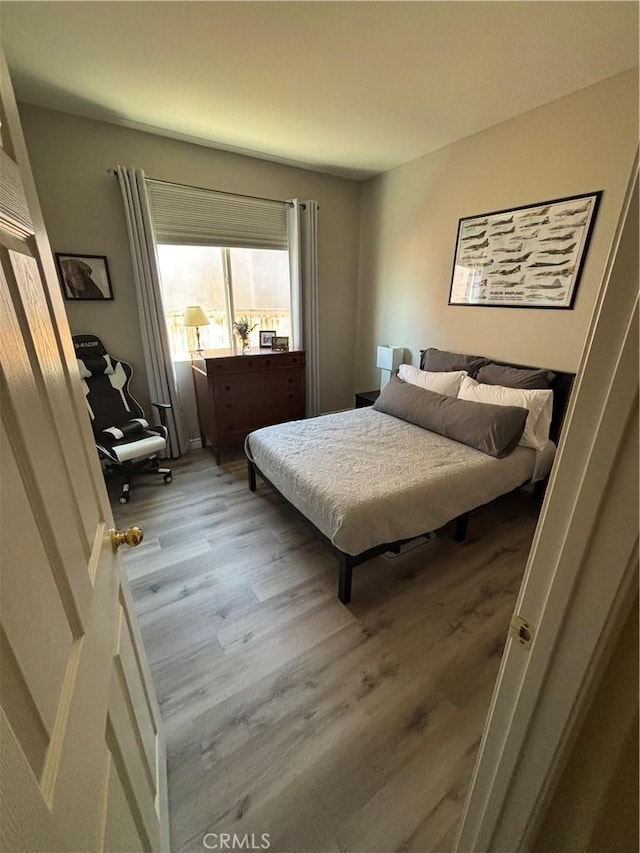 bedroom featuring light wood-type flooring