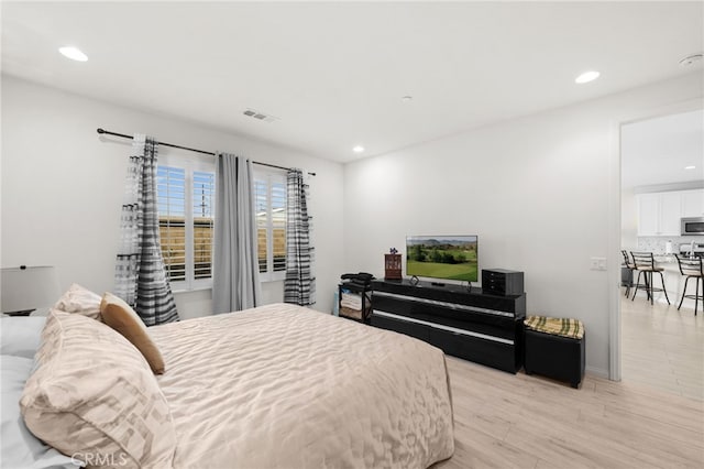 bedroom with light wood-type flooring