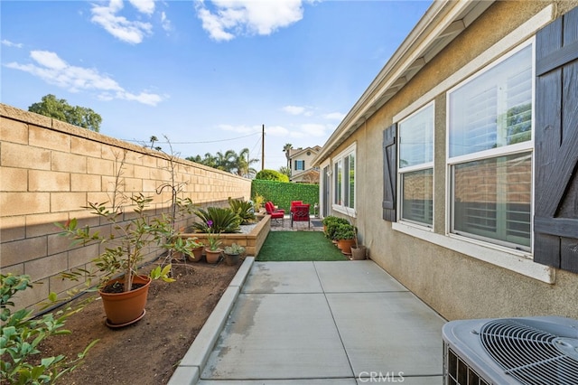 exterior space featuring central AC and a patio area