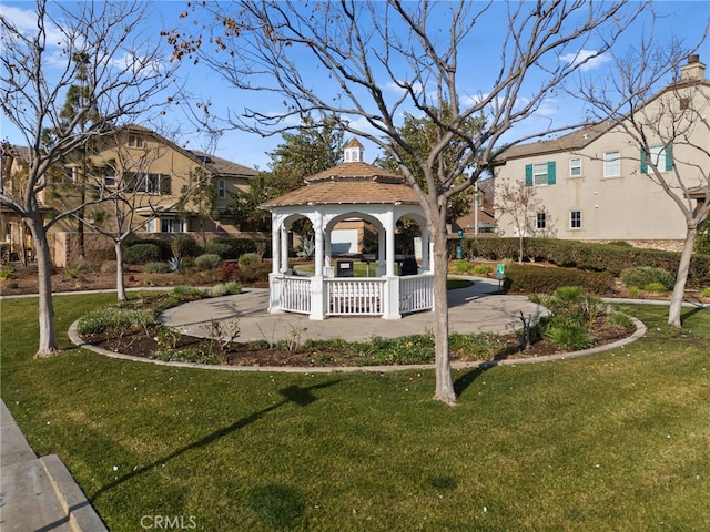 view of property's community with a gazebo and a lawn