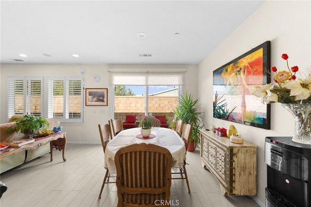 dining room with light hardwood / wood-style flooring