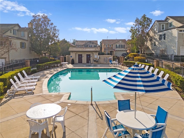 view of swimming pool with a patio area