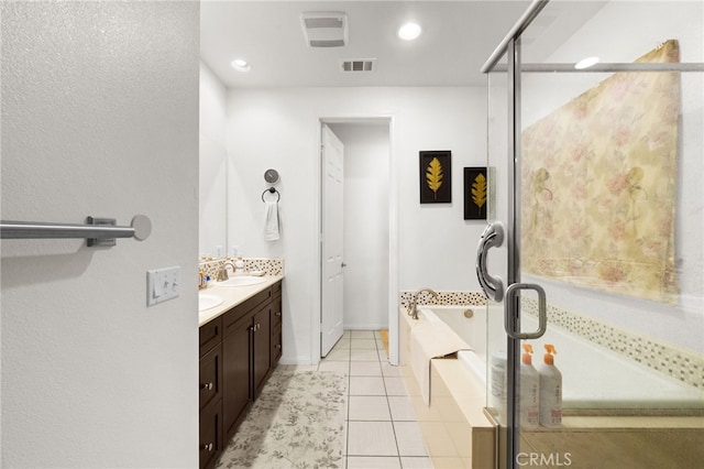 bathroom featuring vanity, tile patterned floors, and independent shower and bath