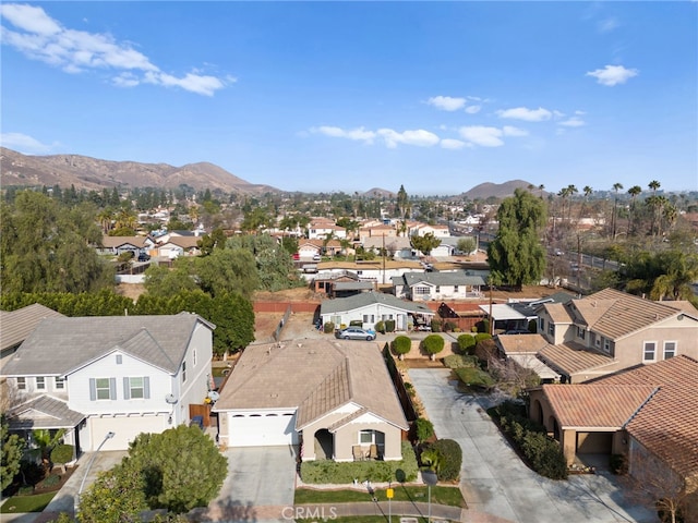 birds eye view of property featuring a mountain view