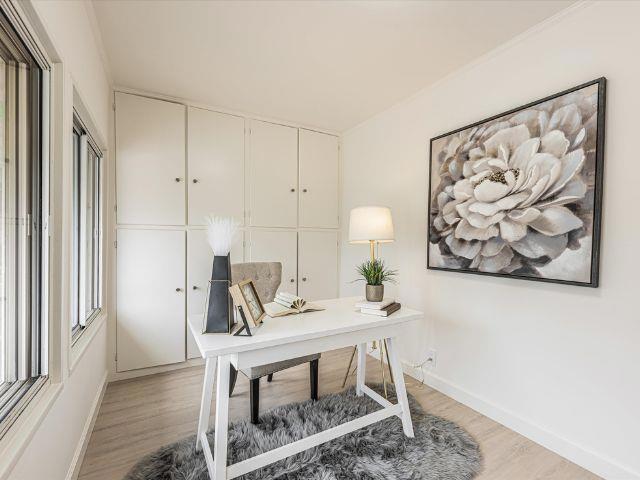 office space with light hardwood / wood-style flooring