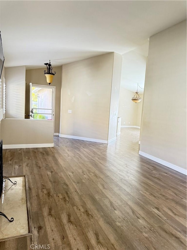 unfurnished living room with wood-type flooring