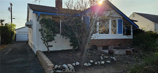 view of property exterior featuring a garage