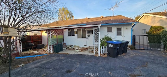 back of house featuring central AC unit