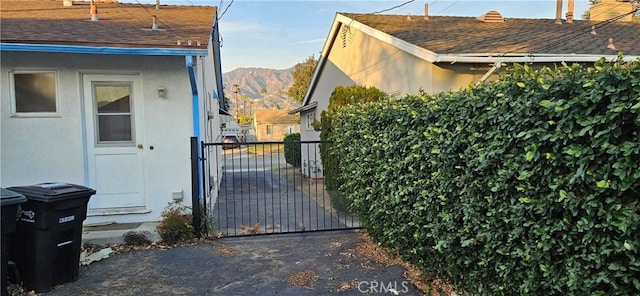 view of gate featuring a mountain view