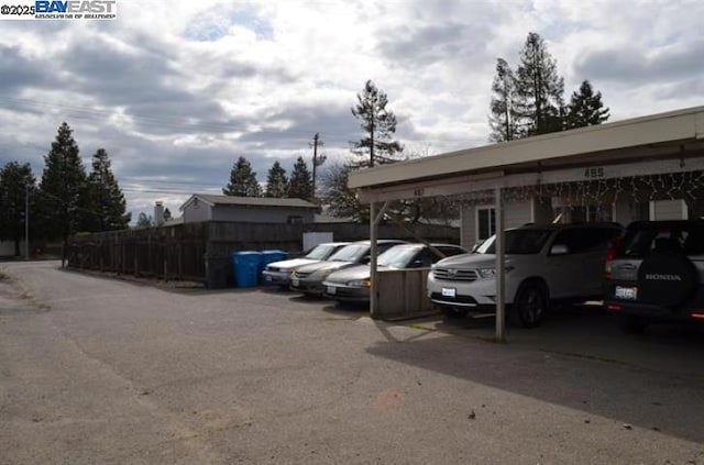 view of parking / parking lot with a carport