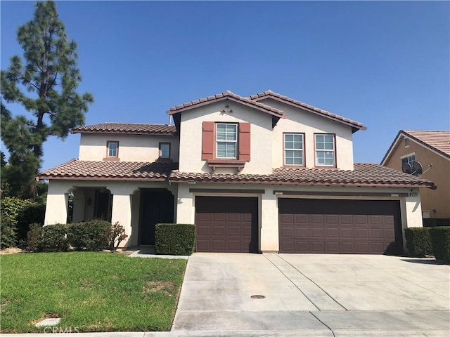 mediterranean / spanish-style home with a garage and a front lawn