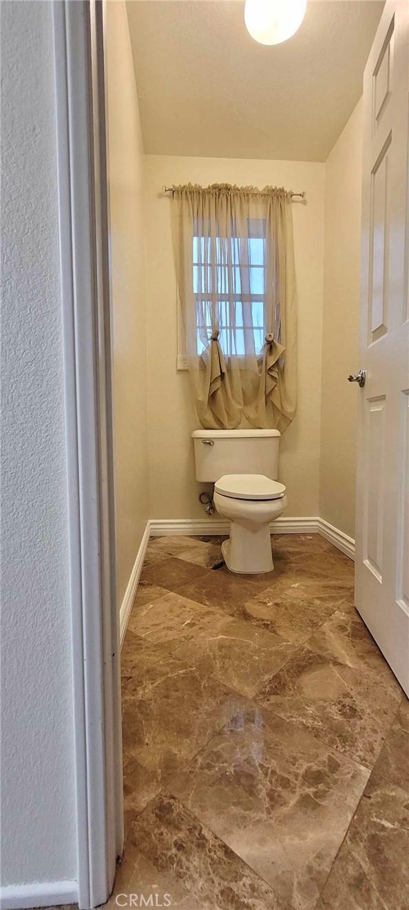 bathroom featuring toilet