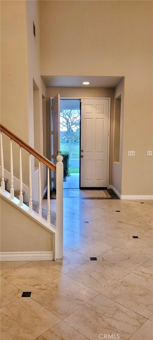 entryway with a high ceiling