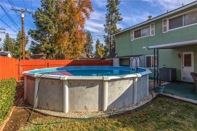 view of swimming pool featuring central AC