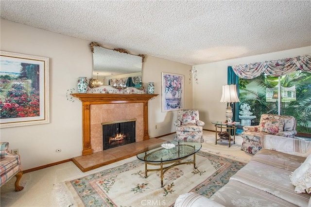 carpeted living room with a premium fireplace and a textured ceiling