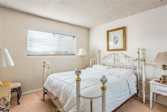 carpeted bedroom featuring a textured ceiling