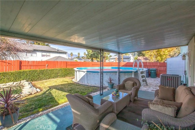 view of patio with a fenced in pool