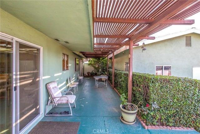 view of patio featuring a pergola