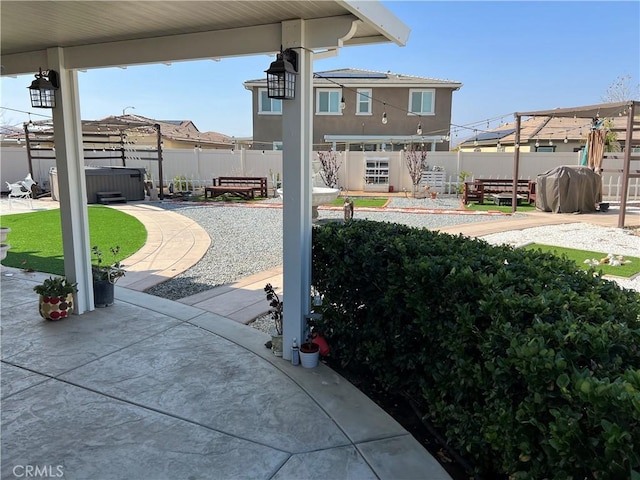 view of patio with a hot tub and area for grilling