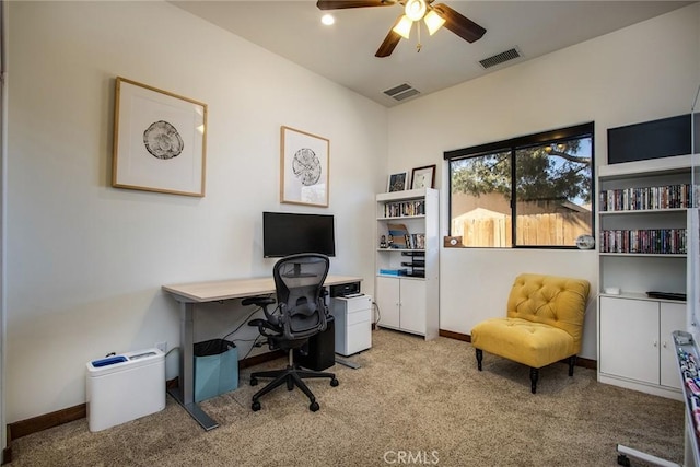 office featuring ceiling fan and light colored carpet