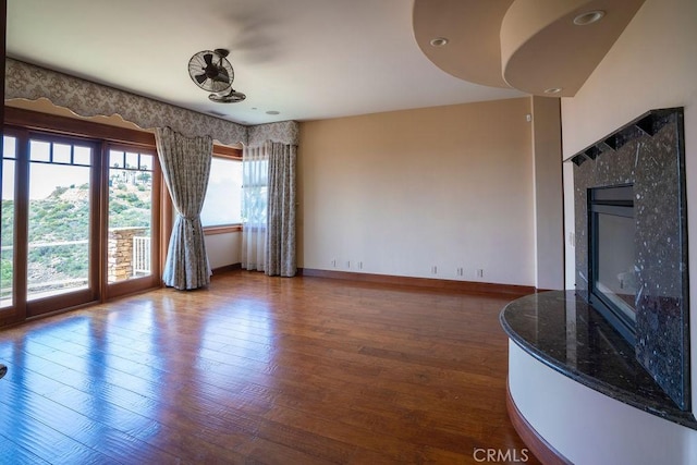 unfurnished living room with wood-type flooring