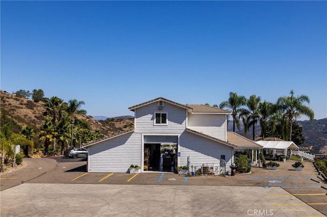 exterior space featuring a mountain view and a garage