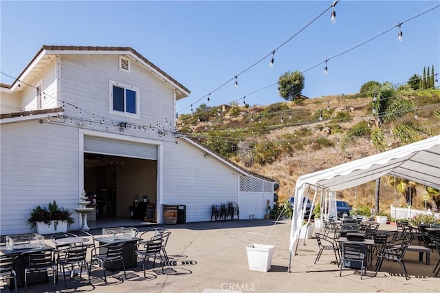 back of property with a patio area and a pergola