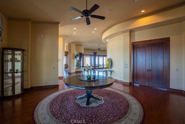 foyer featuring ceiling fan, ornamental molding, and wood-type flooring