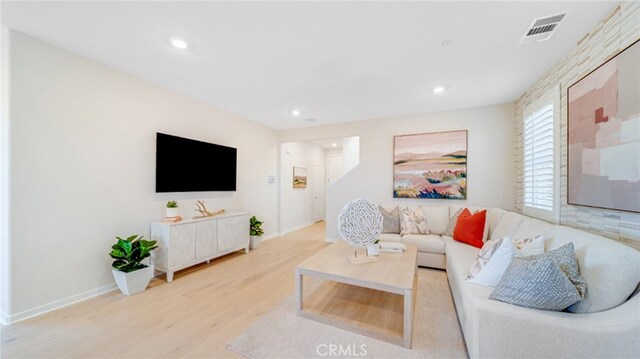 living room with light hardwood / wood-style flooring