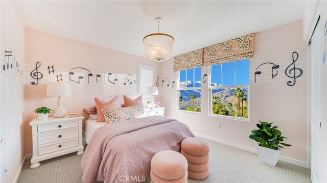 carpeted bedroom with a notable chandelier