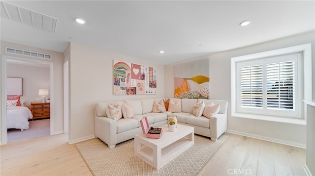 living room with light hardwood / wood-style floors