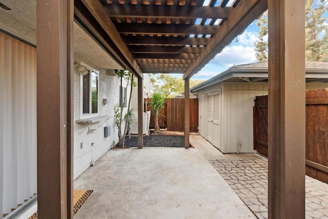 view of patio / terrace featuring an outbuilding