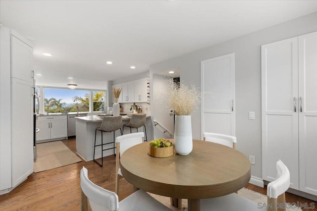 dining room with light hardwood / wood-style flooring