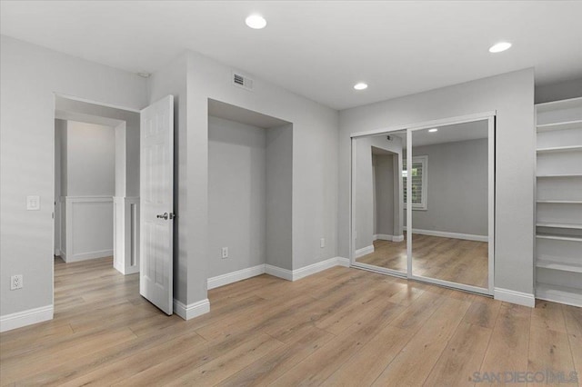 unfurnished bedroom featuring light hardwood / wood-style floors