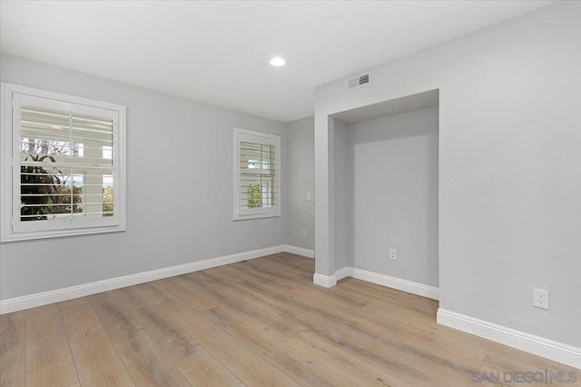 spare room with light wood-type flooring