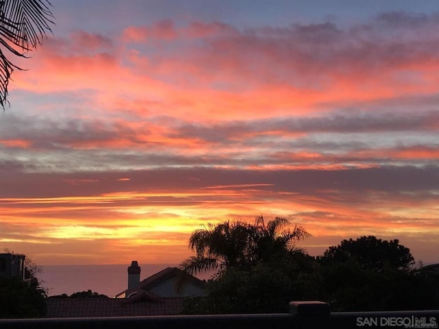 nature at dusk featuring a water view