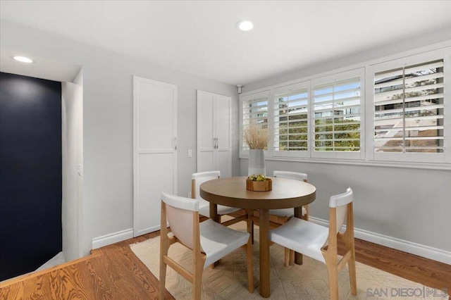 dining area with light hardwood / wood-style flooring