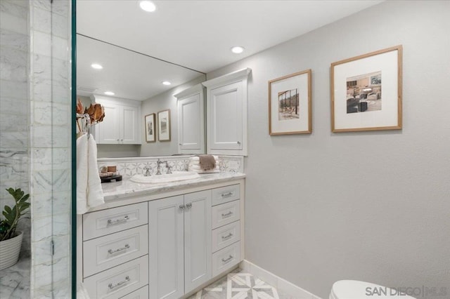 bathroom featuring vanity and toilet