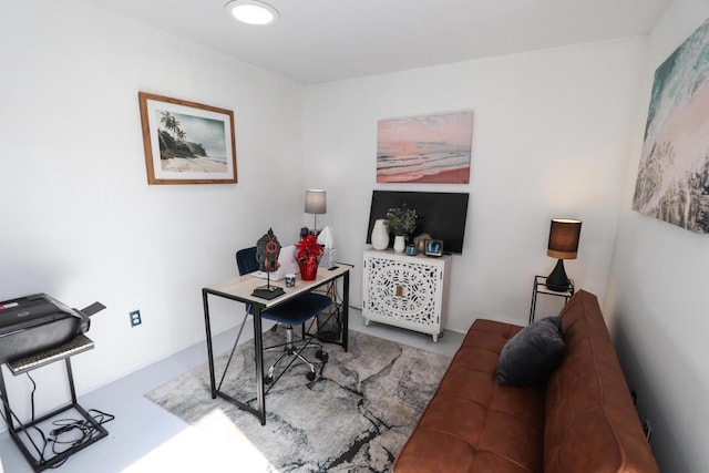 office area featuring concrete floors