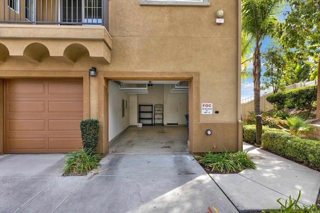 view of exterior entry featuring a garage