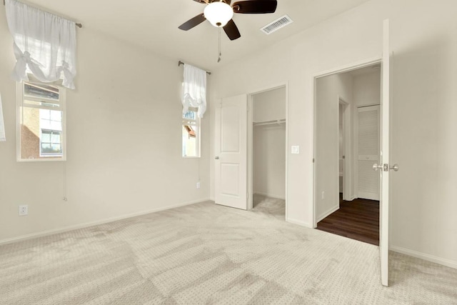 unfurnished bedroom featuring carpet flooring and ceiling fan