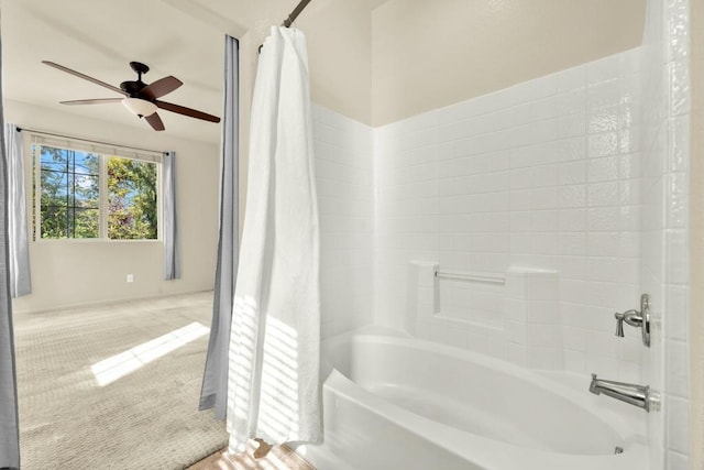 bathroom featuring ceiling fan and shower / bath combo with shower curtain