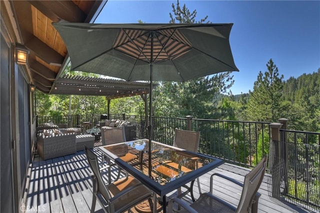 wooden deck with an outdoor living space and a pergola