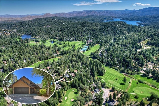 bird's eye view with a water and mountain view