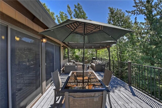 wooden terrace with outdoor lounge area