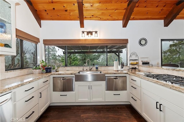 kitchen with white cabinetry, light stone countertops, sink, and wood ceiling