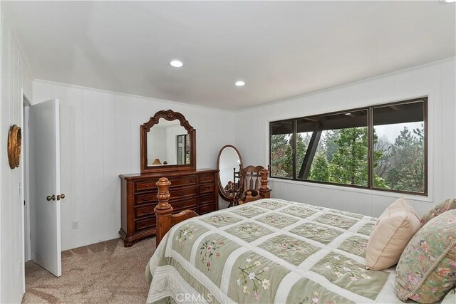 bedroom featuring light colored carpet