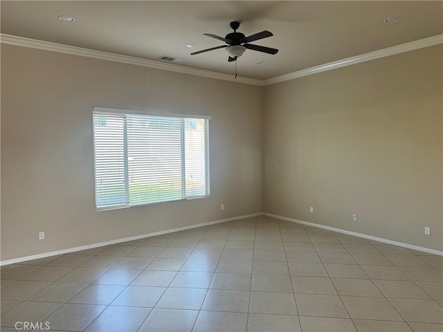 tiled spare room featuring ceiling fan and ornamental molding