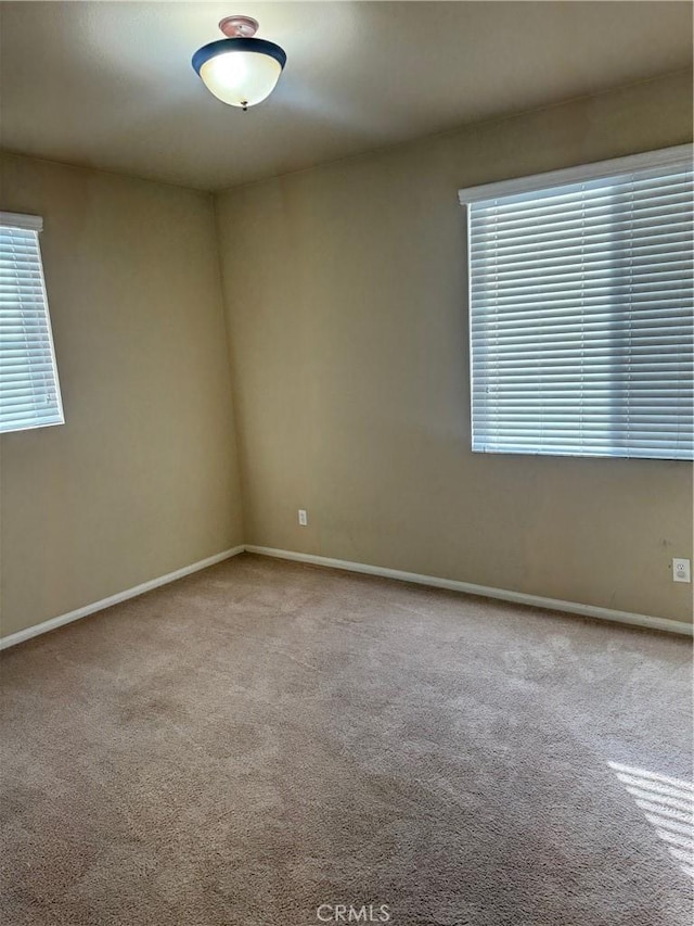 spare room with light carpet