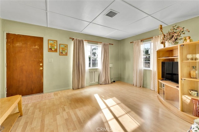 living room with hardwood / wood-style flooring and a wealth of natural light